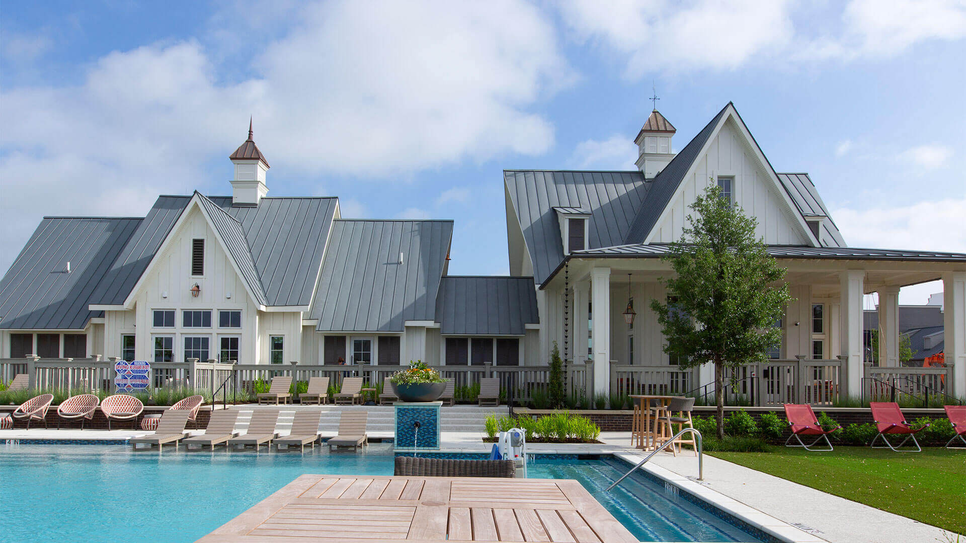 A clubhouse and swimming pool are shown at a Hillwood community development.