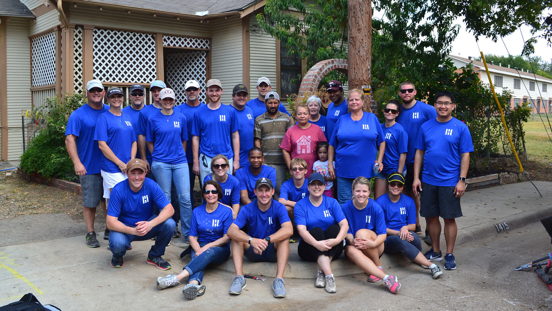 A group of Hillwood employees gather at a volunteer opportunity.