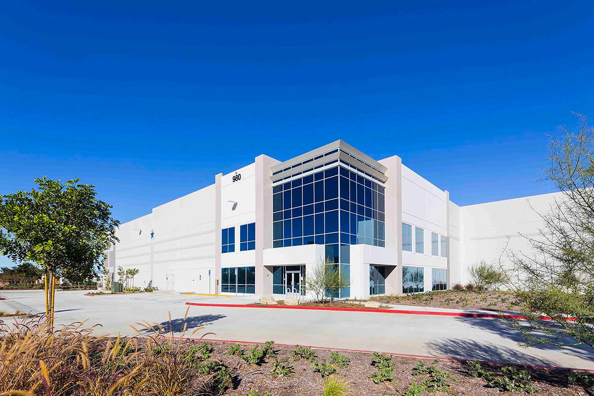 A glass-fronted office building, part of a joint investment property venture.